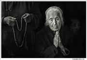 Old lady in prayer Puning Temple Chengde